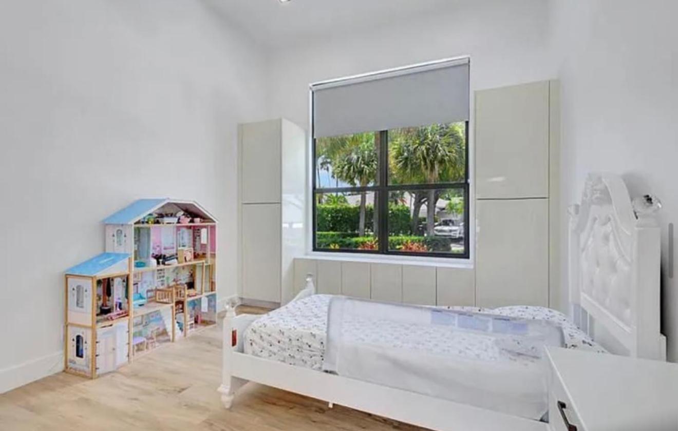 2299 Northwest 55th Street Boca Raton, FL 33496 - Photo 30 of 47 a living room with furniture and a window