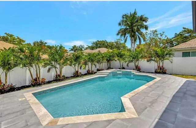 a view of a backyard with a garden