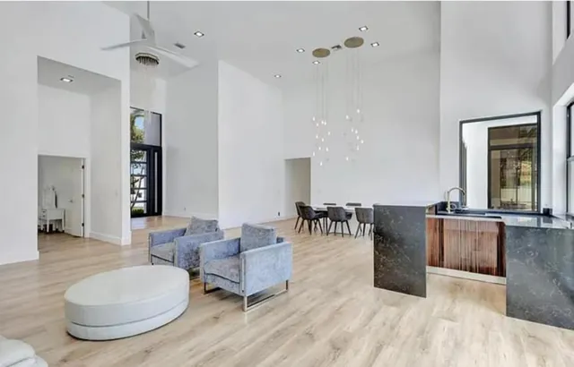 a living room with furniture and wooden floor