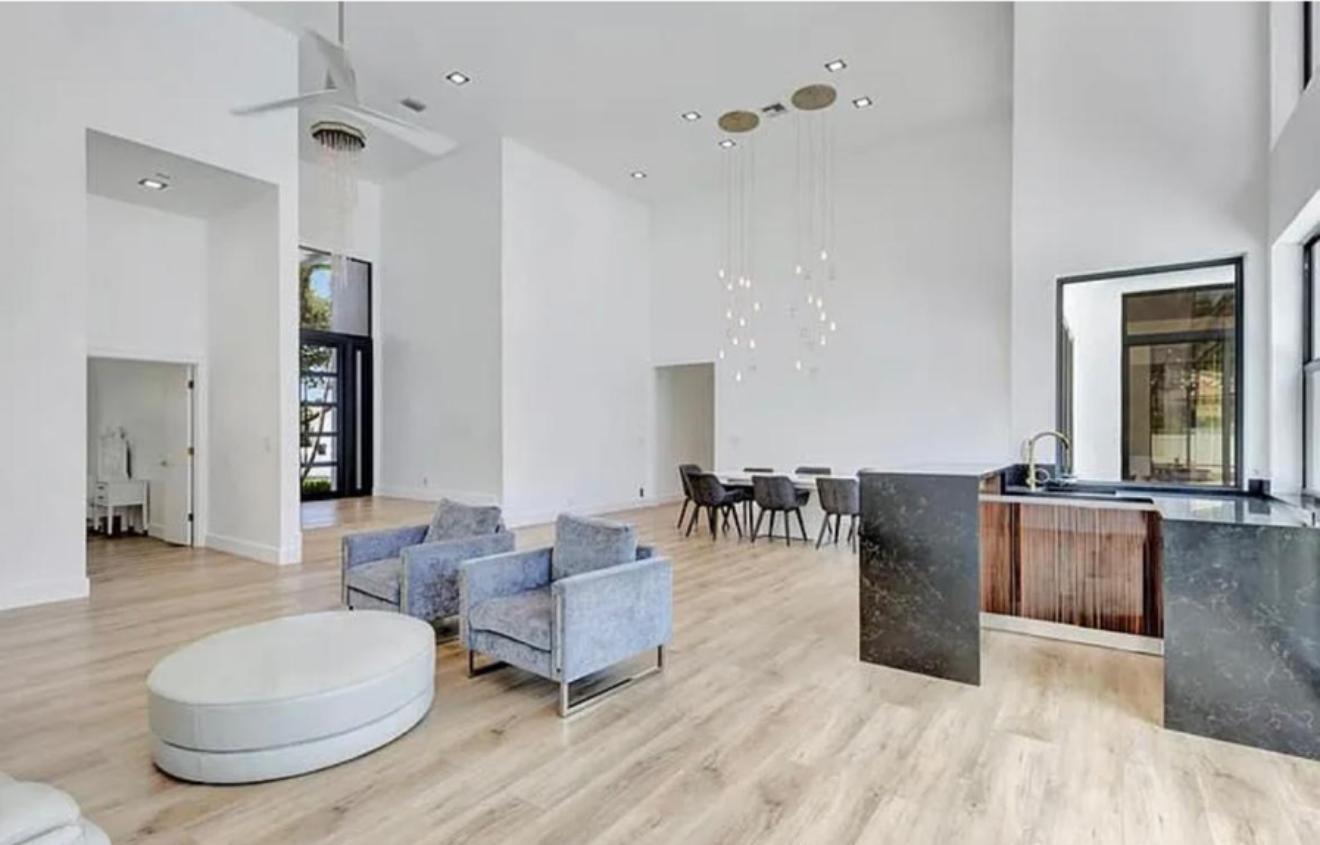 2299 Northwest 55th Street Boca Raton, FL 33496 - Photo 5 of 47 a living room with furniture and wooden floor