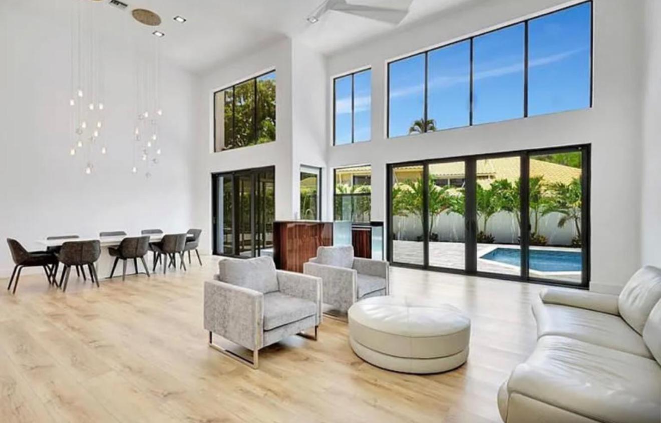 2299 Northwest 55th Street Boca Raton, FL 33496 - Photo 6 of 47 a living room with furniture and a large window