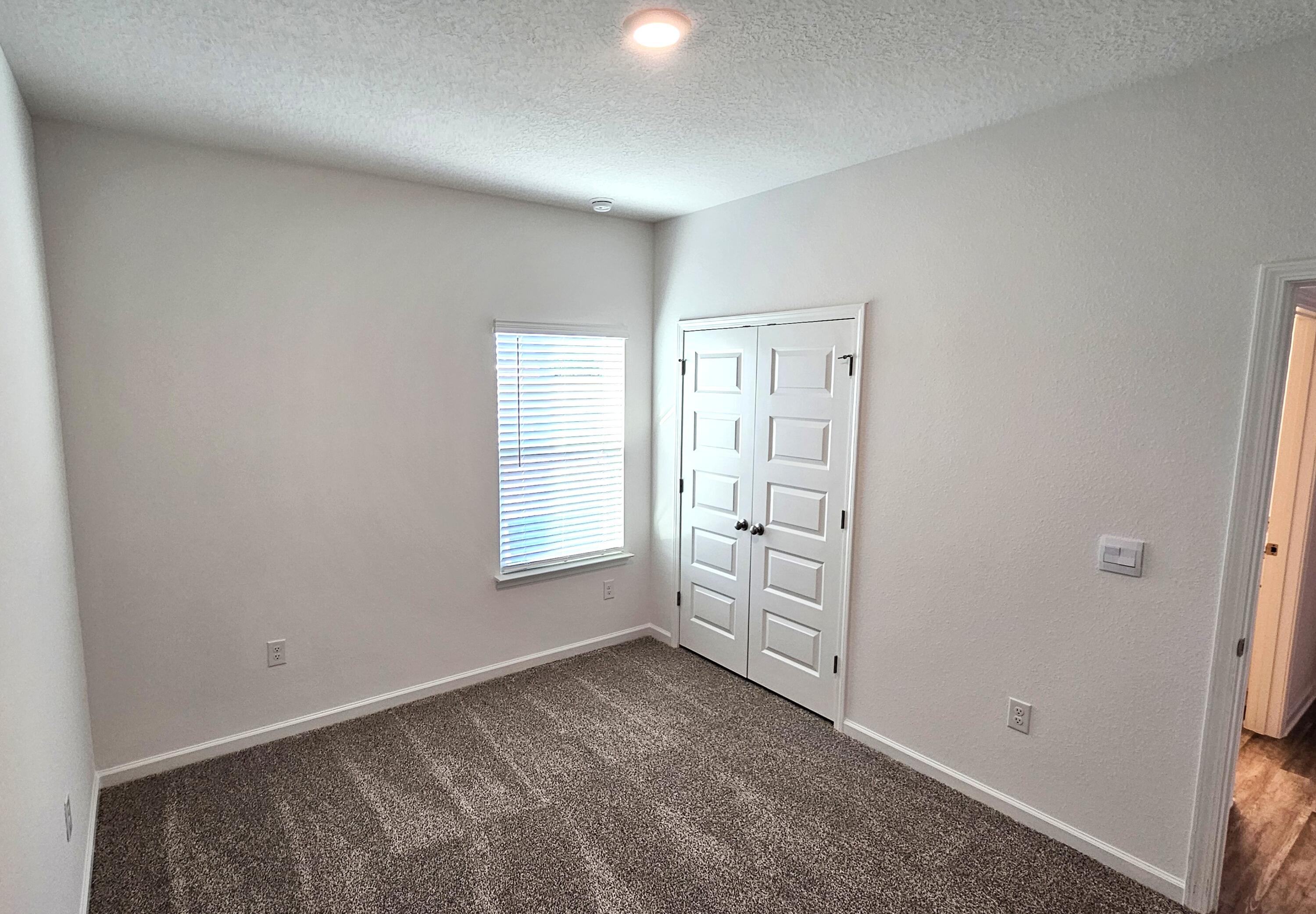 96 Sweetthorn Street Freeport, FL 32439 - Photo 13 of 18 an empty room with windows