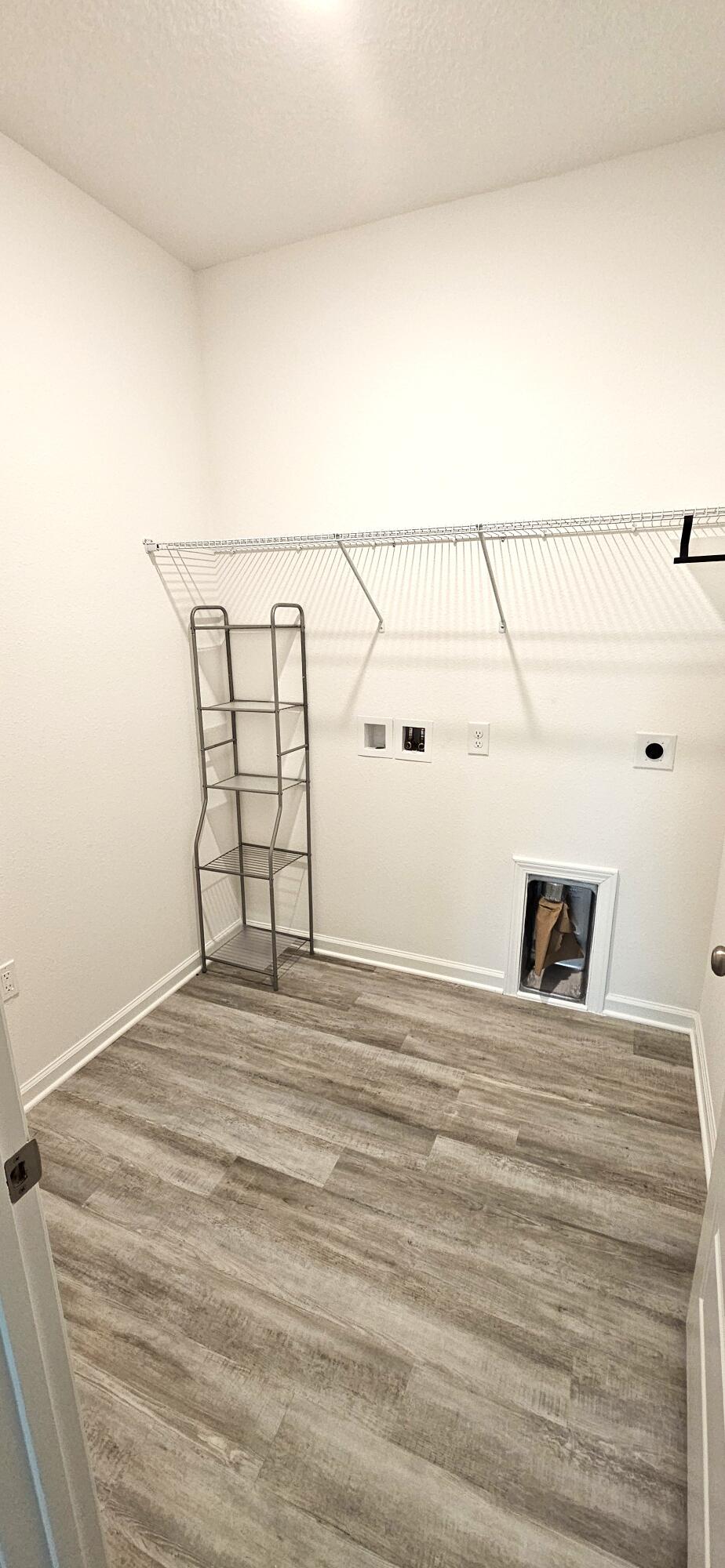 96 Sweetthorn Street Freeport, FL 32439 - Photo 17 of 18 a view of a room with racks on the wall