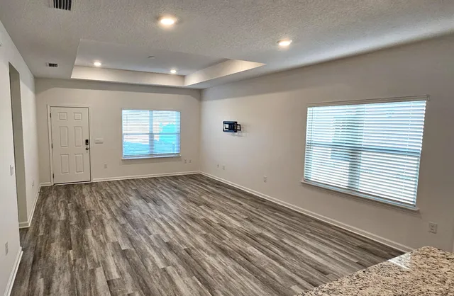 a view of an empty room and a window