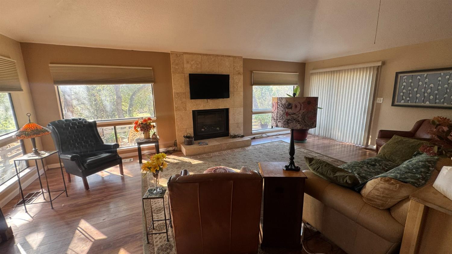31160 Revis Road Coarsegold, CA 93614 - Photo 7 of 15 a living room with furniture a fireplace and a flat screen tv