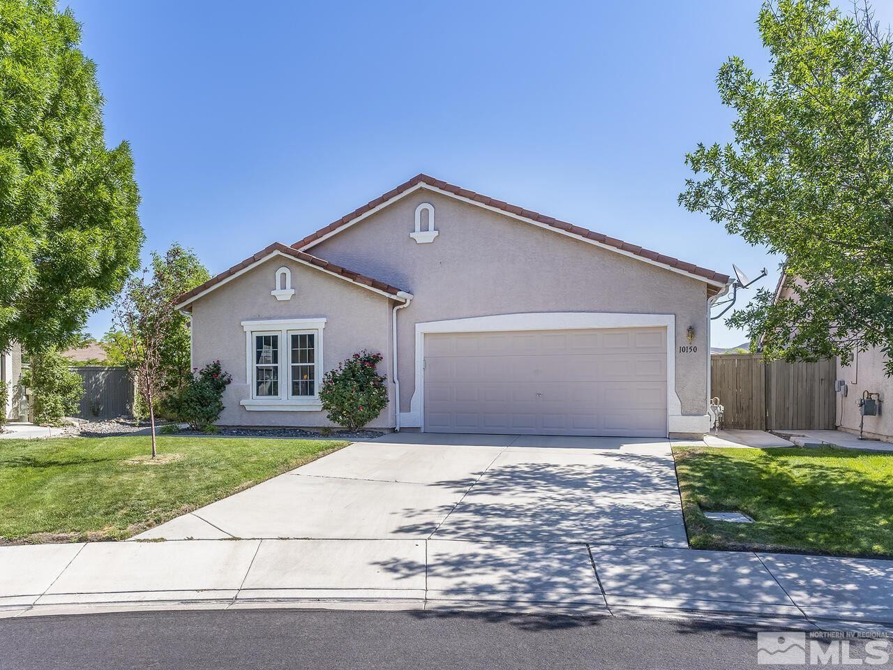 10150 Robilee Court Reno, NV 89521 - Photo 1 of 40 a front view of house with yard and green space