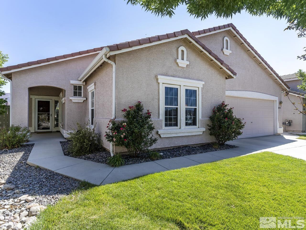 10150 Robilee Court Reno, NV 89521 - Photo 2 of 40 a front view of a house with a yard