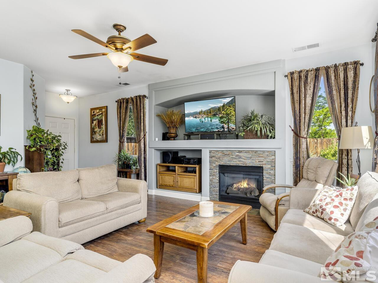 10150 Robilee Court Reno, NV 89521 - Photo 4 of 40 a living room with furniture and a fireplace
