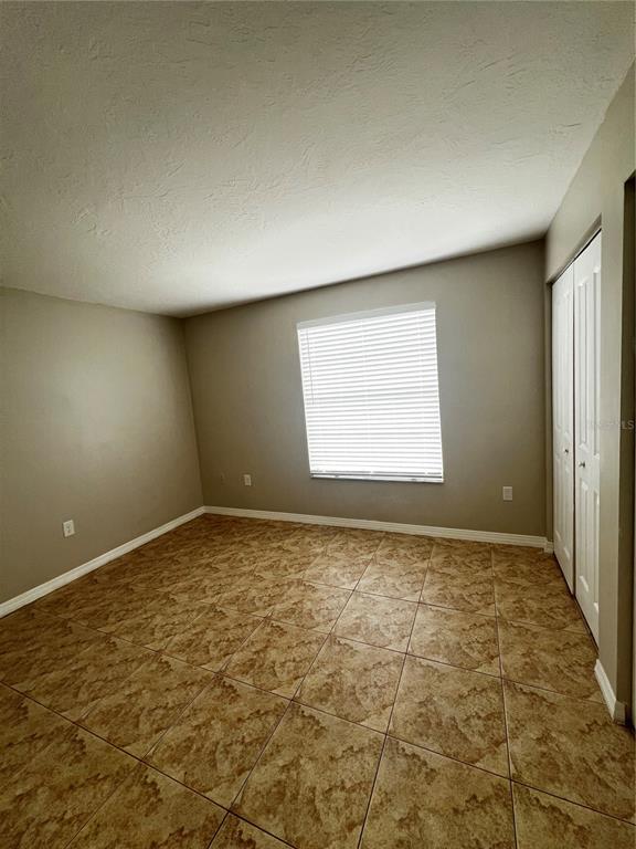 7200 Jenner Avenue New Port Richey, FL 34655 - Photo 11 of 12 a view of an empty room and window