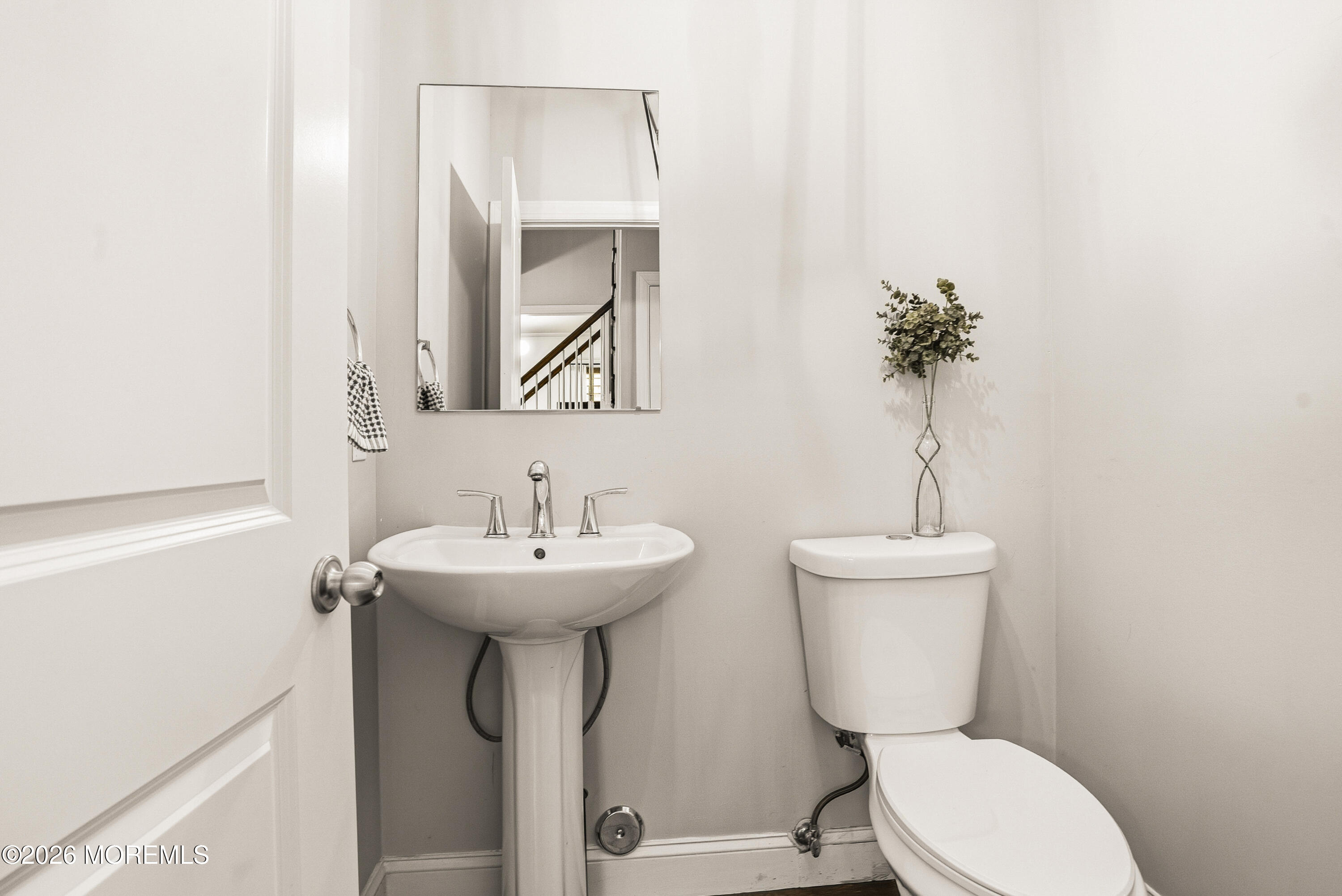 127 West 2nd Street Howell, NJ 07731 - Photo 12 of 29 a bathroom with a toilet sink and mirror