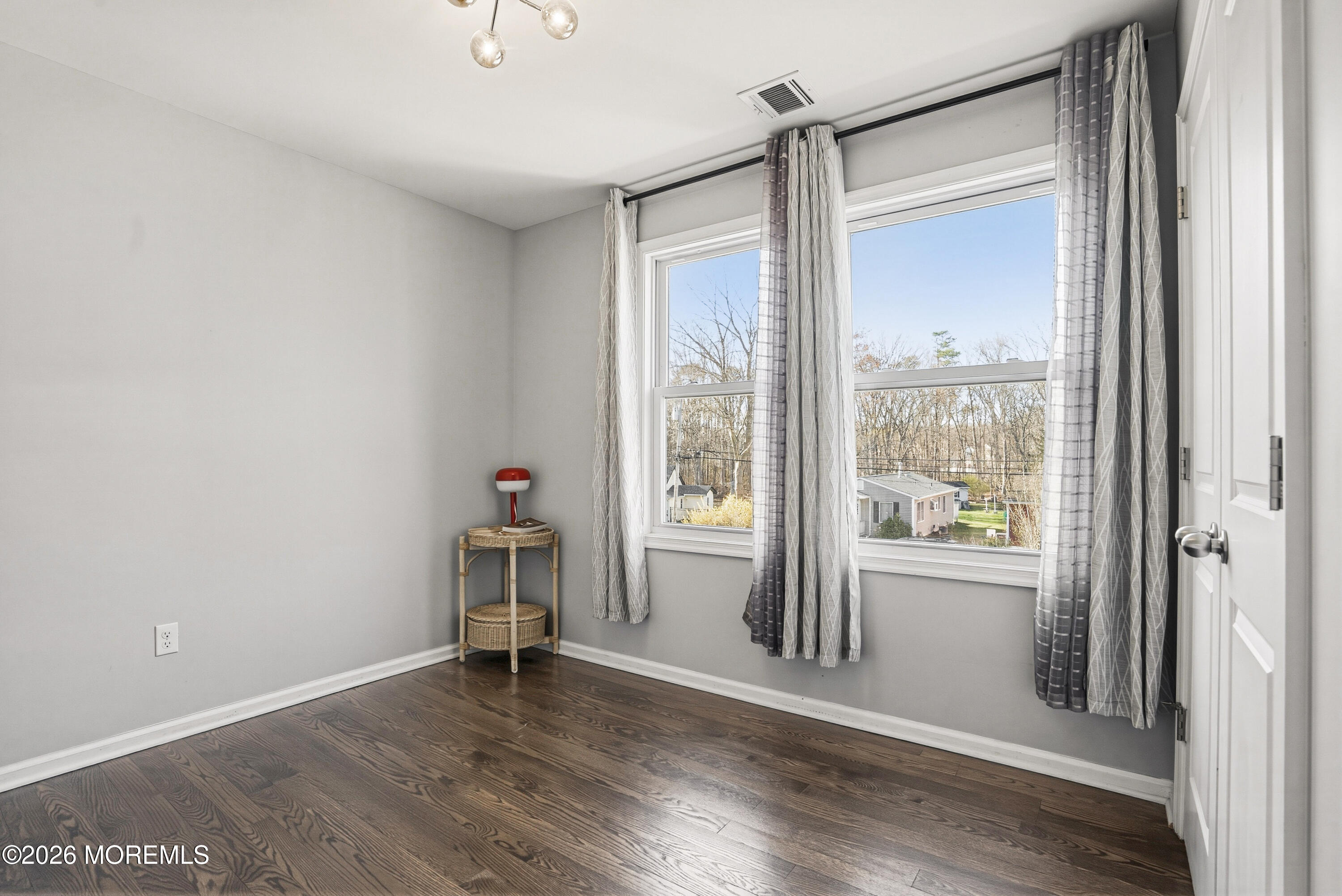 127 West 2nd Street Howell, NJ 07731 - Photo 21 of 29 a view of empty room with wooden floor and fan