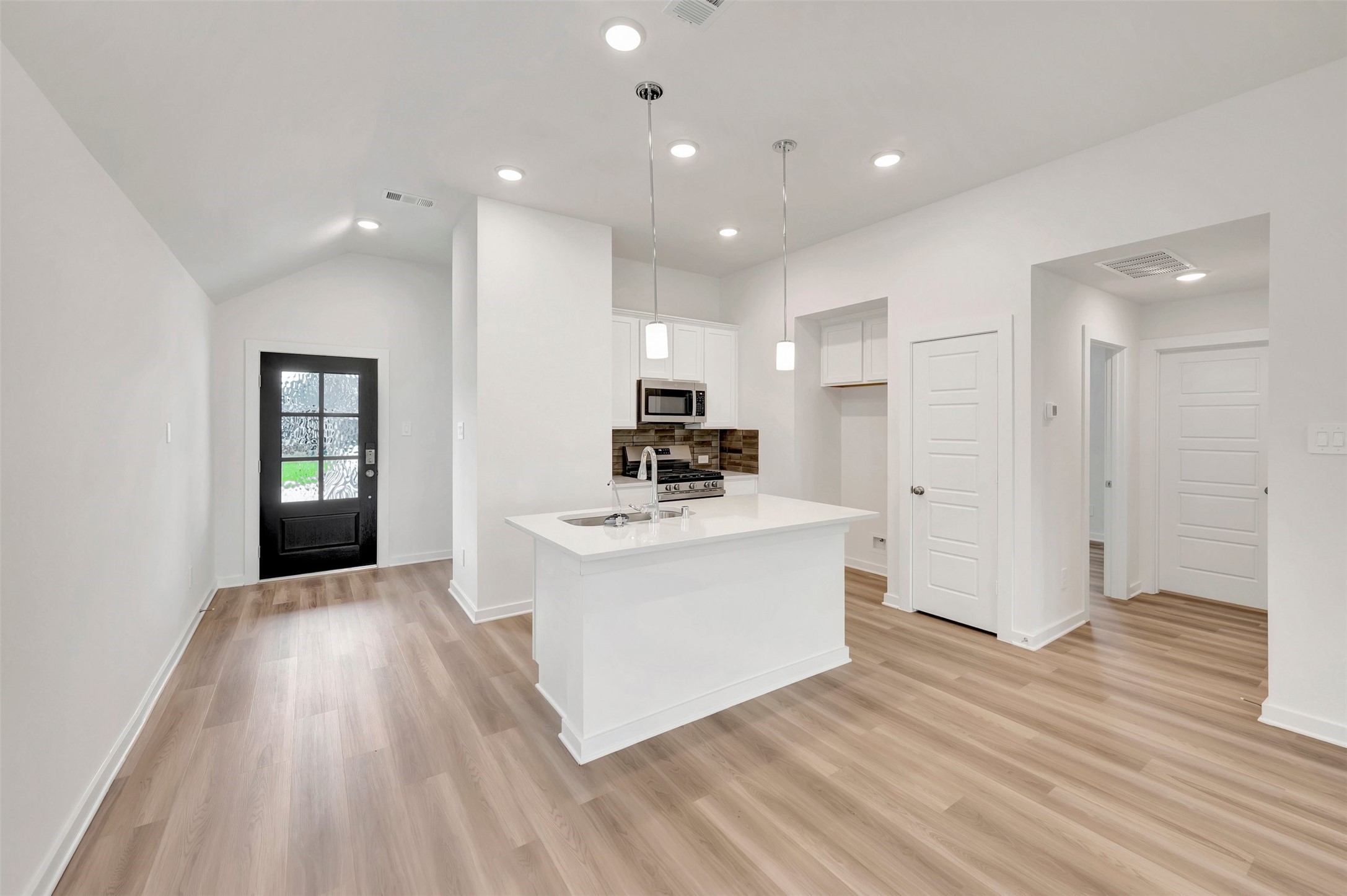 543 Flower Reed Court Magnolia, TX 77354 - Photo 24 of 46 a view of kitchen with sink and wooden floor