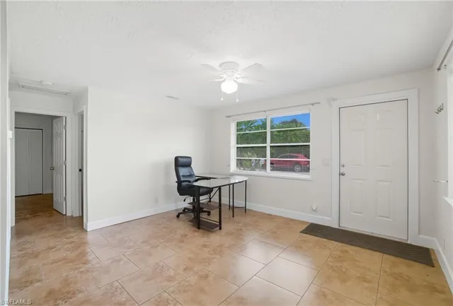 a view of workspace with furniture and window