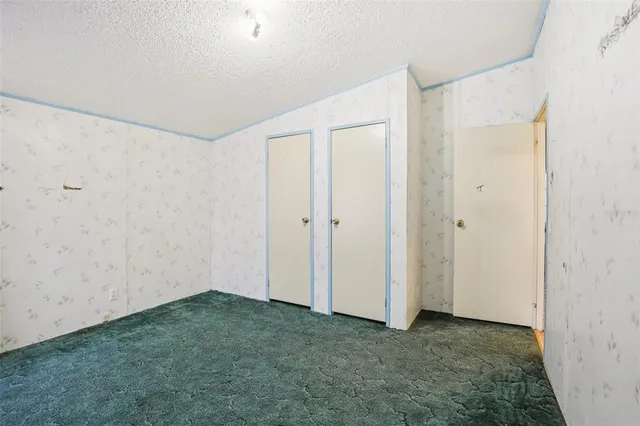 a spacious bathroom with a bathtub shower sink mirror and toilet