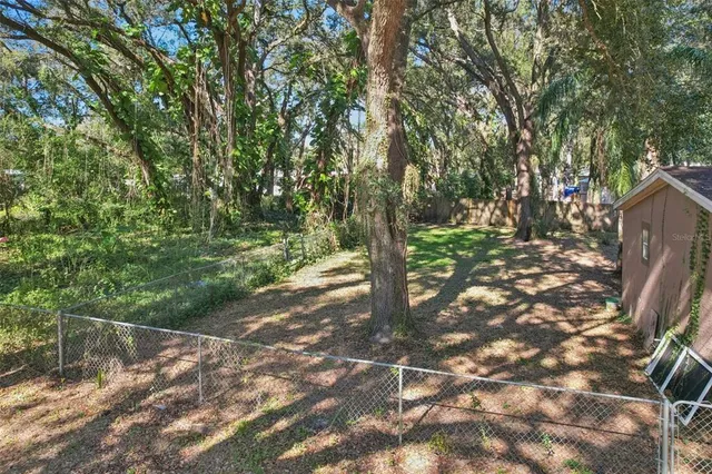 a backyard of a house with lots of green space