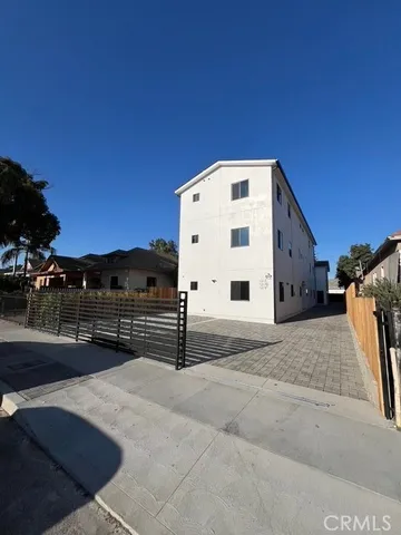 a view of a building with a yard