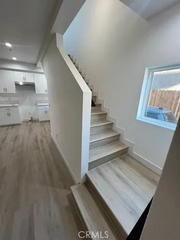 a view of entryway and kitchen
