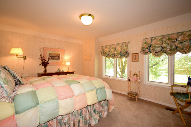 316 Trinity Lane Oak Brook, IL 60523 - Photo 19 of 25 a bedroom with a bed and a window