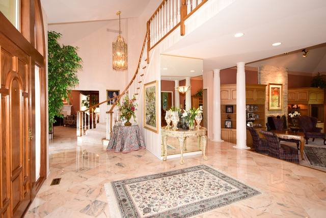 316 Trinity Lane Oak Brook, IL 60523 - Photo 2 of 25 a view of a hallway with dining area