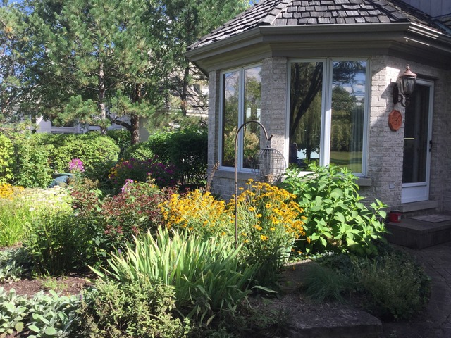 316 Trinity Lane Oak Brook, IL 60523 - Photo 22 of 25 a view of a house with potted plants