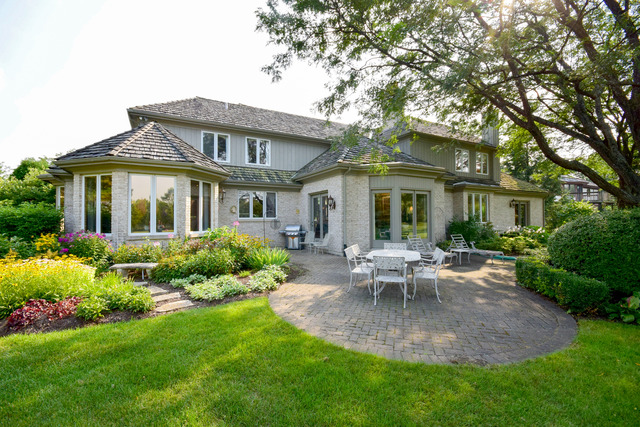 316 Trinity Lane Oak Brook, IL 60523 - Photo 23 of 25 a view of a house with backyard sitting area and garden