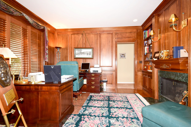 316 Trinity Lane Oak Brook, IL 60523 - Photo 4 of 25 a living room with furniture a rug and a fireplace