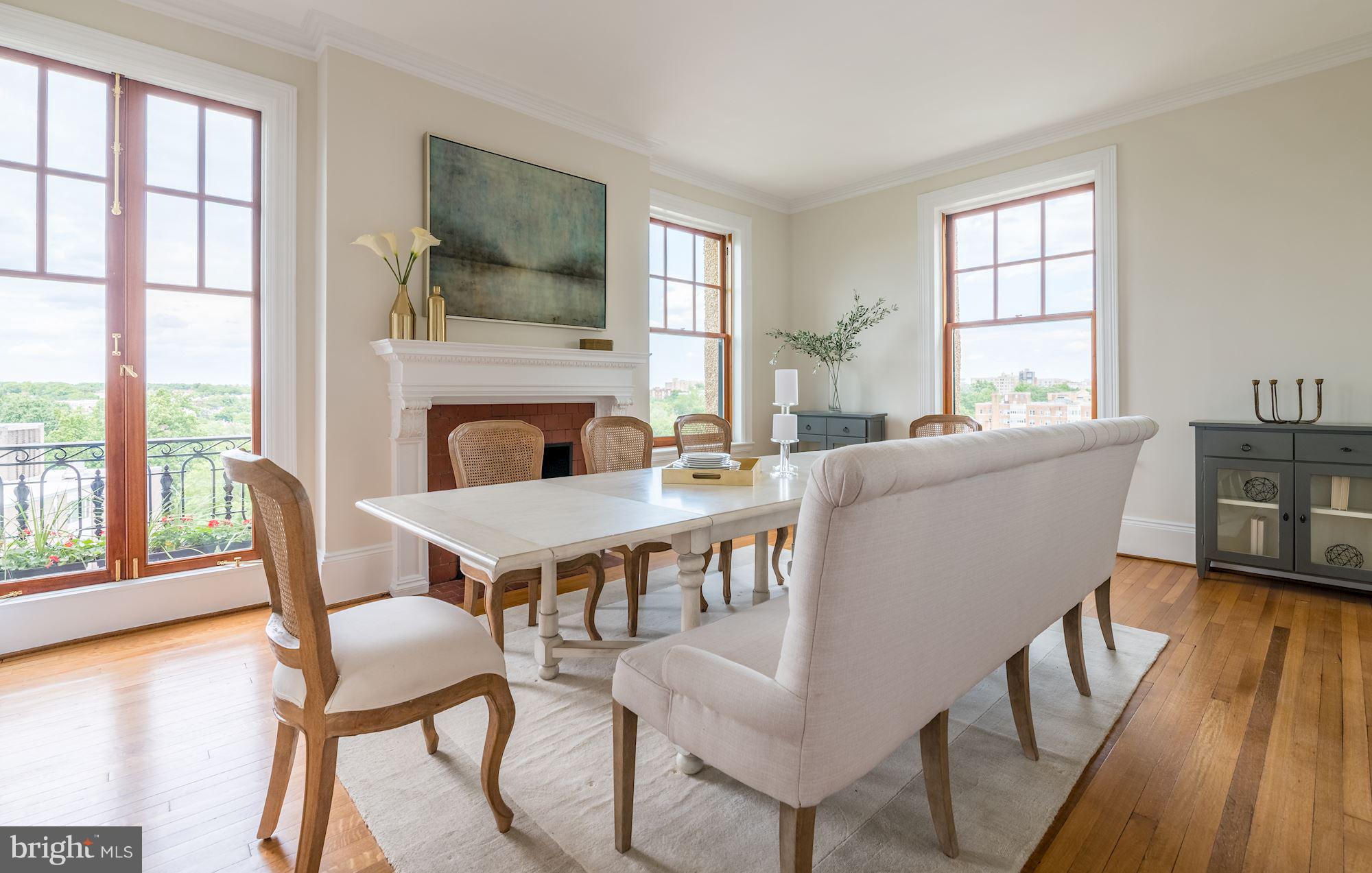 2853 Ontario Road Northwest, Unit 505 Washington, DC 20009 - Photo 11 of 29 a living room with furniture a fireplace and a floor to ceiling window