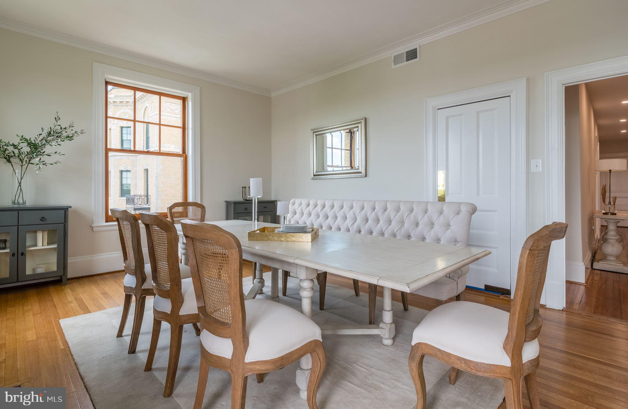 2853 Ontario Road Northwest, Unit 505 Washington, DC 20009 - Photo 12 of 29 a view of a a dining room with furniture window and wooden floor