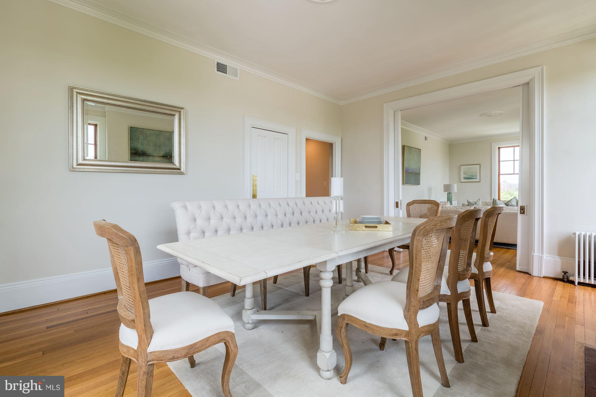 2853 Ontario Road Northwest, Unit 505 Washington, DC 20009 - Photo 13 of 29 a view of a dining room with furniture and wooden floor