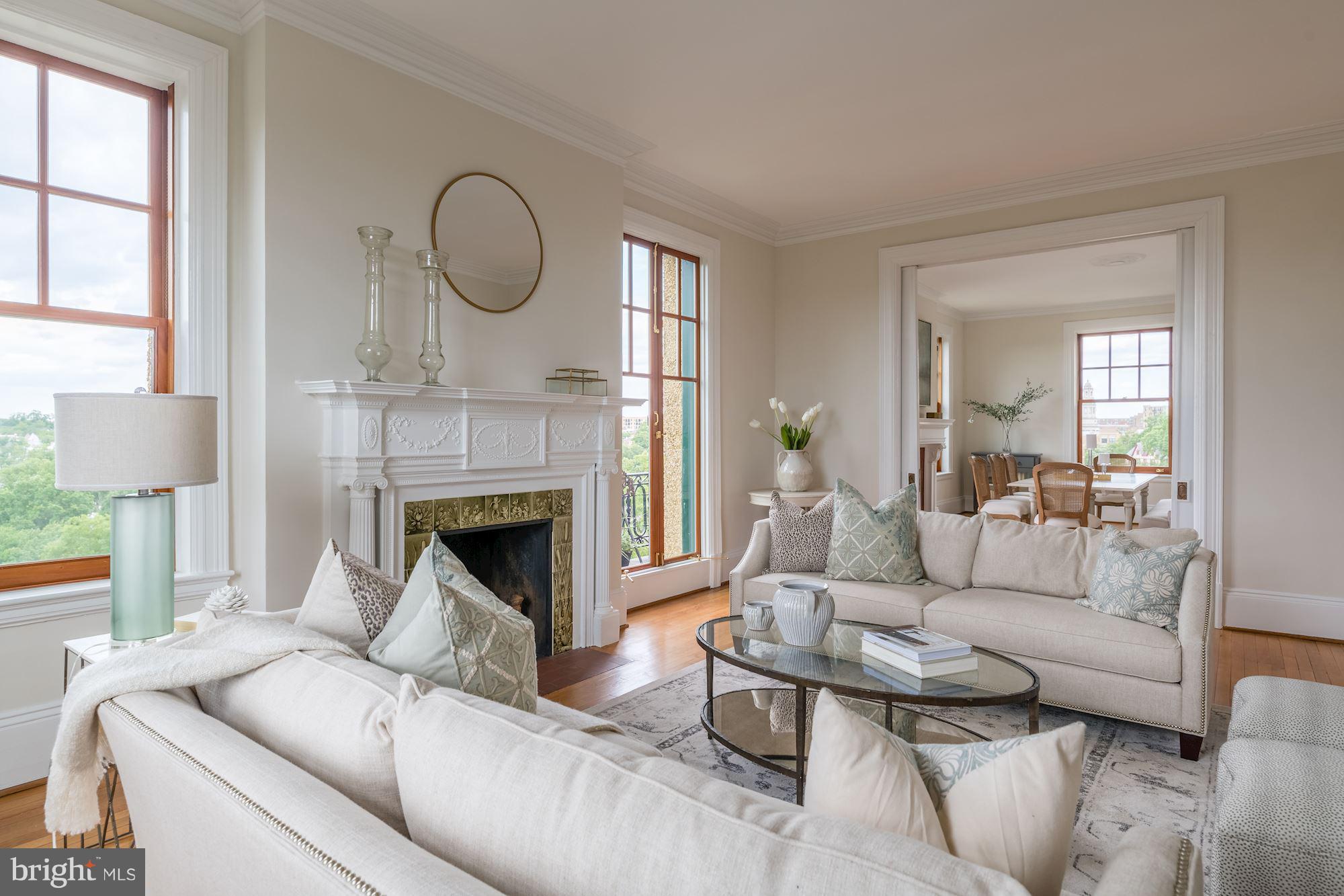 2853 Ontario Road Northwest, Unit 505 Washington, DC 20009 - Photo 7 of 29 a living room with furniture and a fireplace