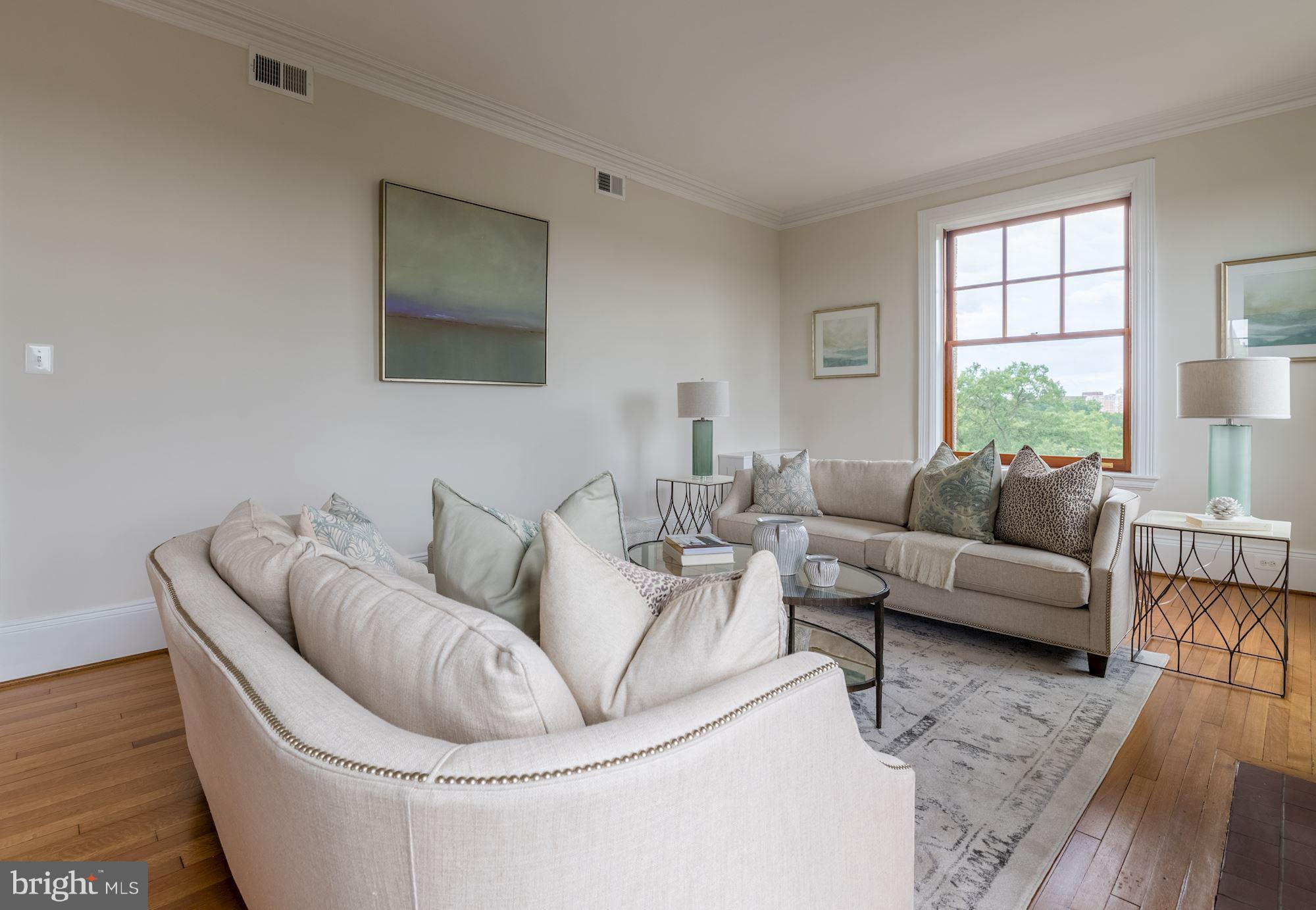 2853 Ontario Road Northwest, Unit 505 Washington, DC 20009 - Photo 8 of 29 a living room with furniture and a large window