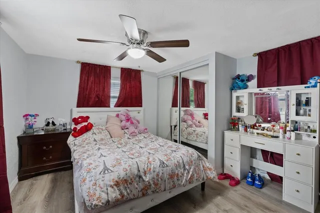 a bedroom with a bed and dresser