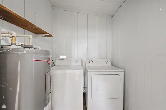 a utility room with dryer and washer