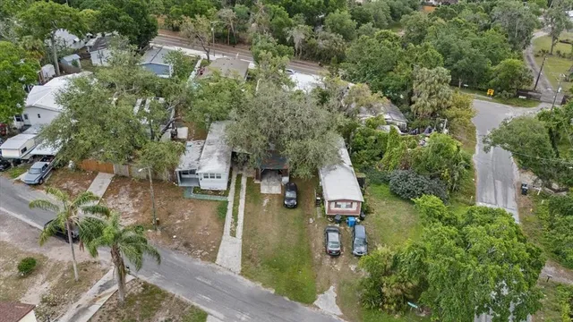 an aerial view of a house with outdoor space