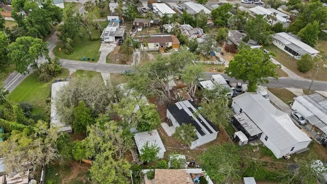 an aerial view of multiple houses with yard