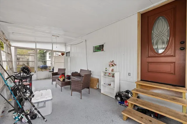 a room with gym equipment and a large window