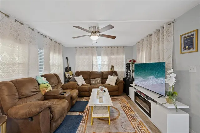 a living room with furniture and a flat screen tv