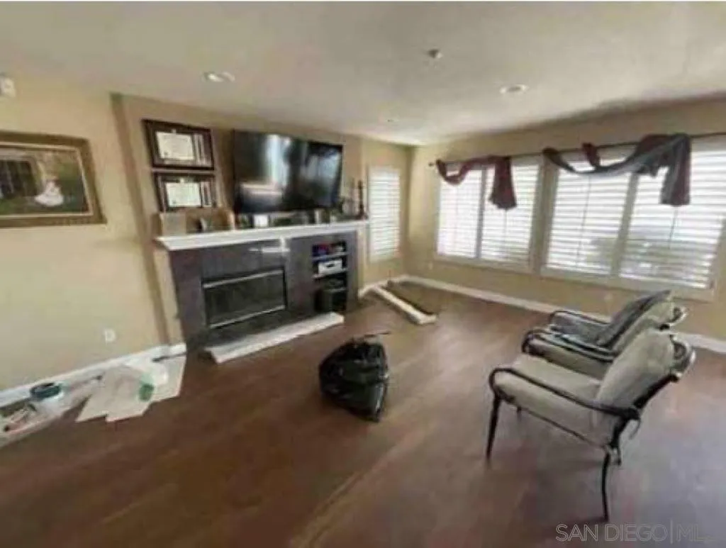 2552 Valley Waters Court Spring Valley, CA 91978 - Photo 13 of 16 a living room with furniture and a flat screen tv