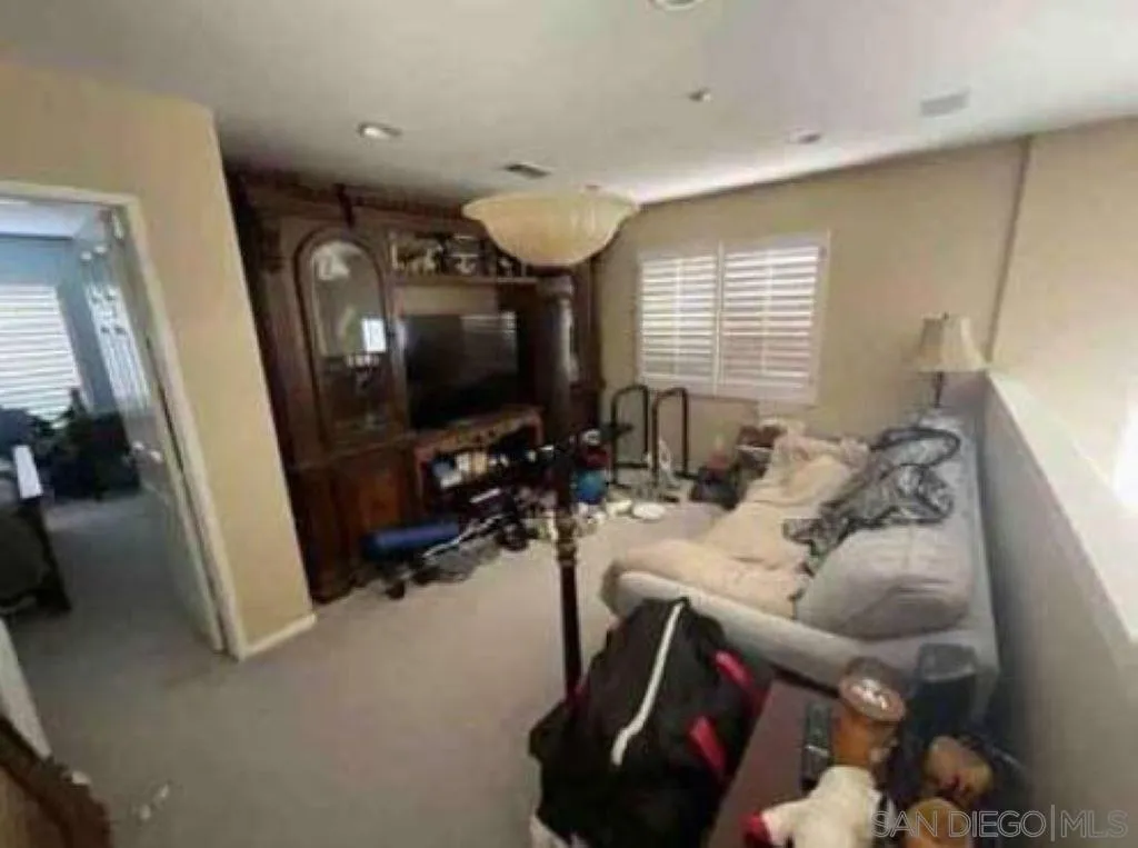 2552 Valley Waters Court Spring Valley, CA 91978 - Photo 16 of 16 a living room with furniture and a flat screen tv
