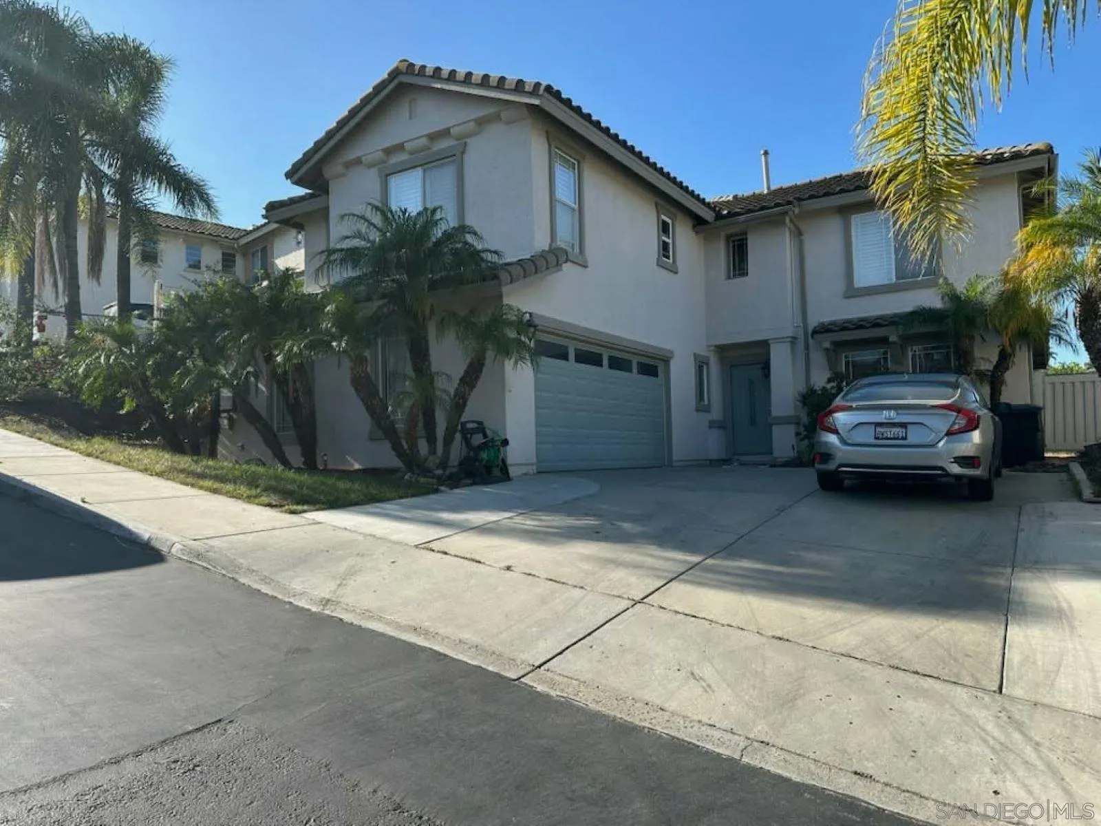 2552 Valley Waters Court Spring Valley, CA 91978 - Photo 3 of 16 a car parked in front of a house