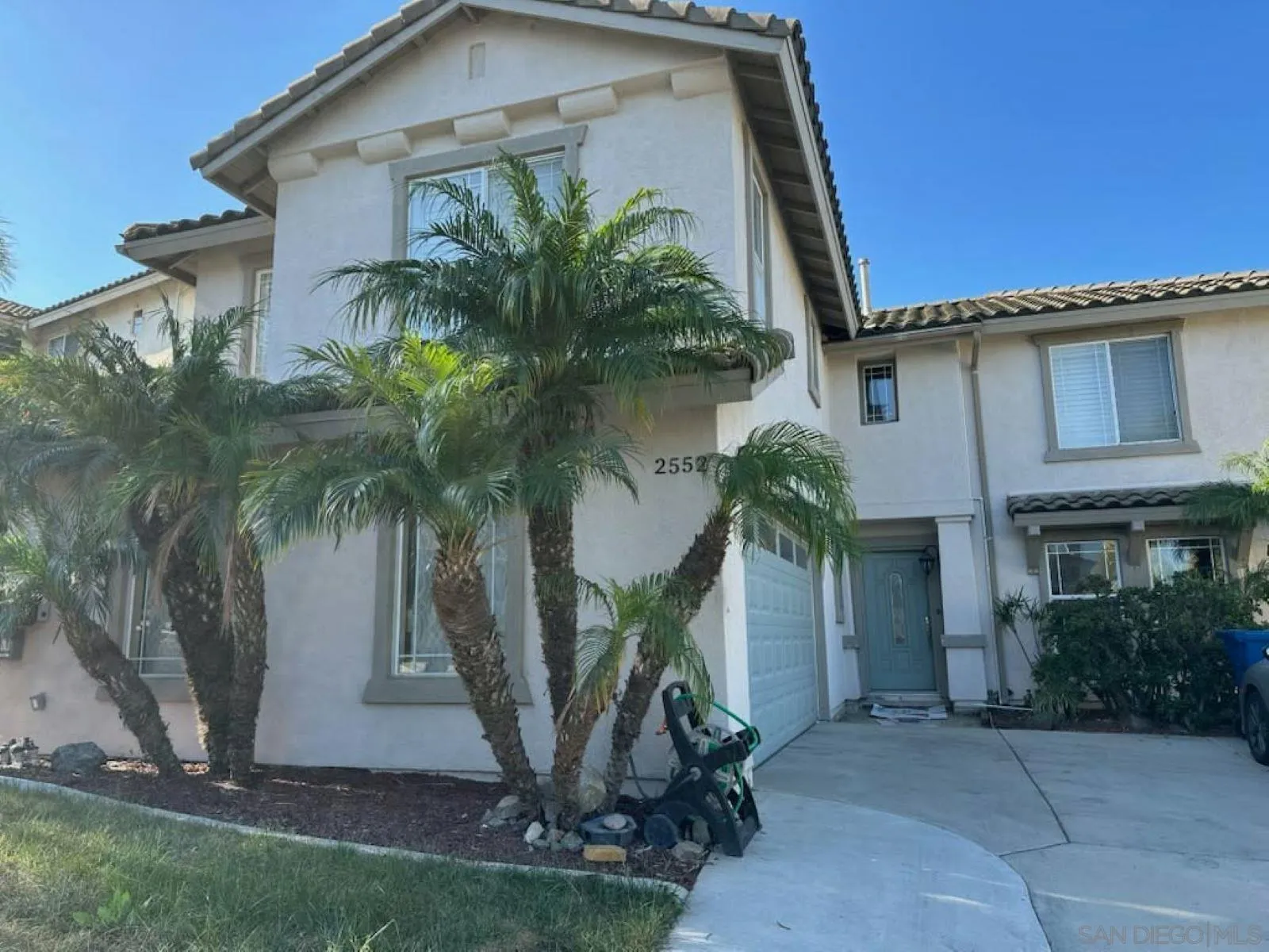 2552 Valley Waters Court Spring Valley, CA 91978 - Photo 4 of 16 a front view of a house with a yard