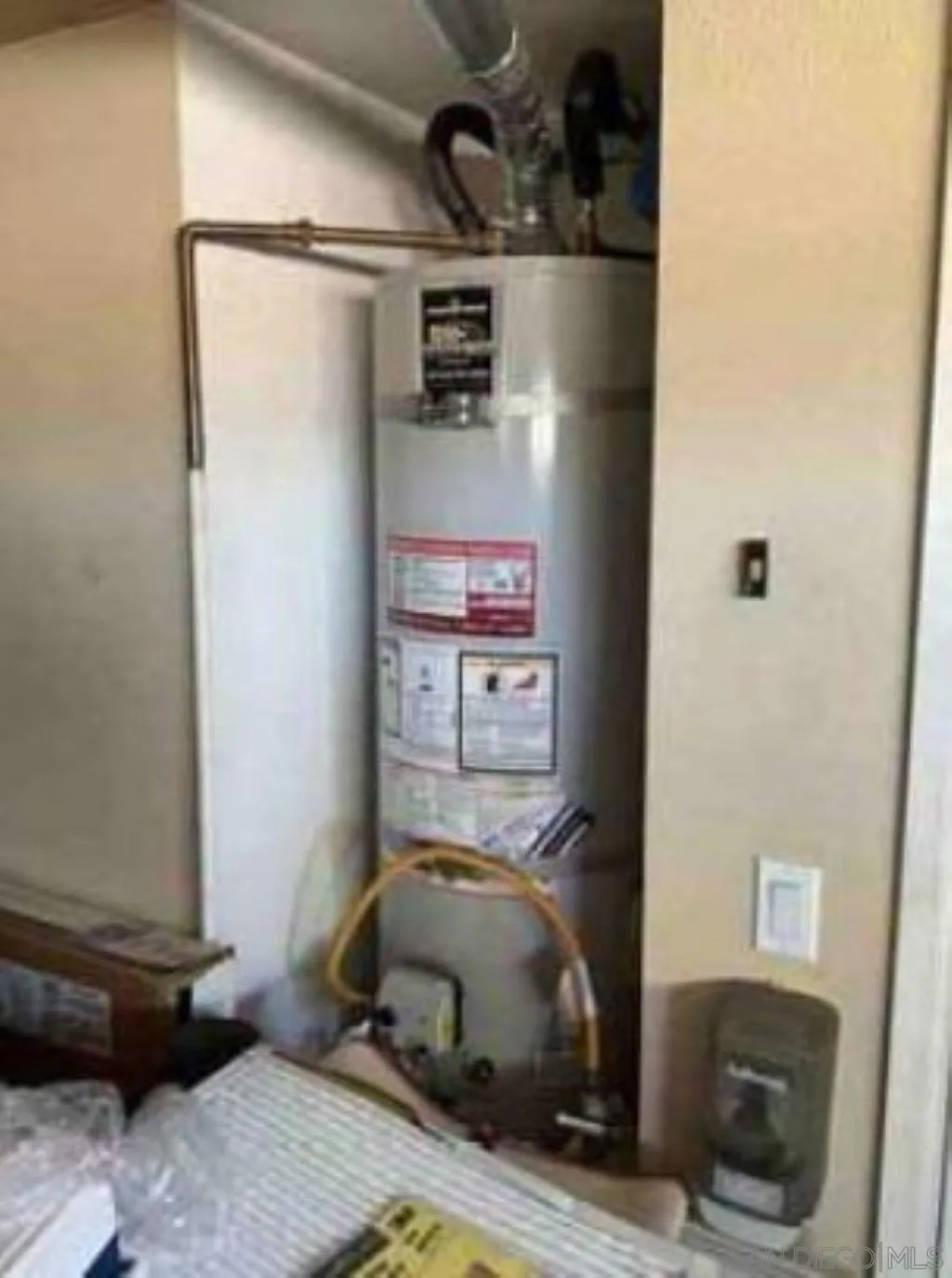 2552 Valley Waters Court Spring Valley, CA 91978 - Photo 9 of 16 a bedroom with a bed and a refrigerator