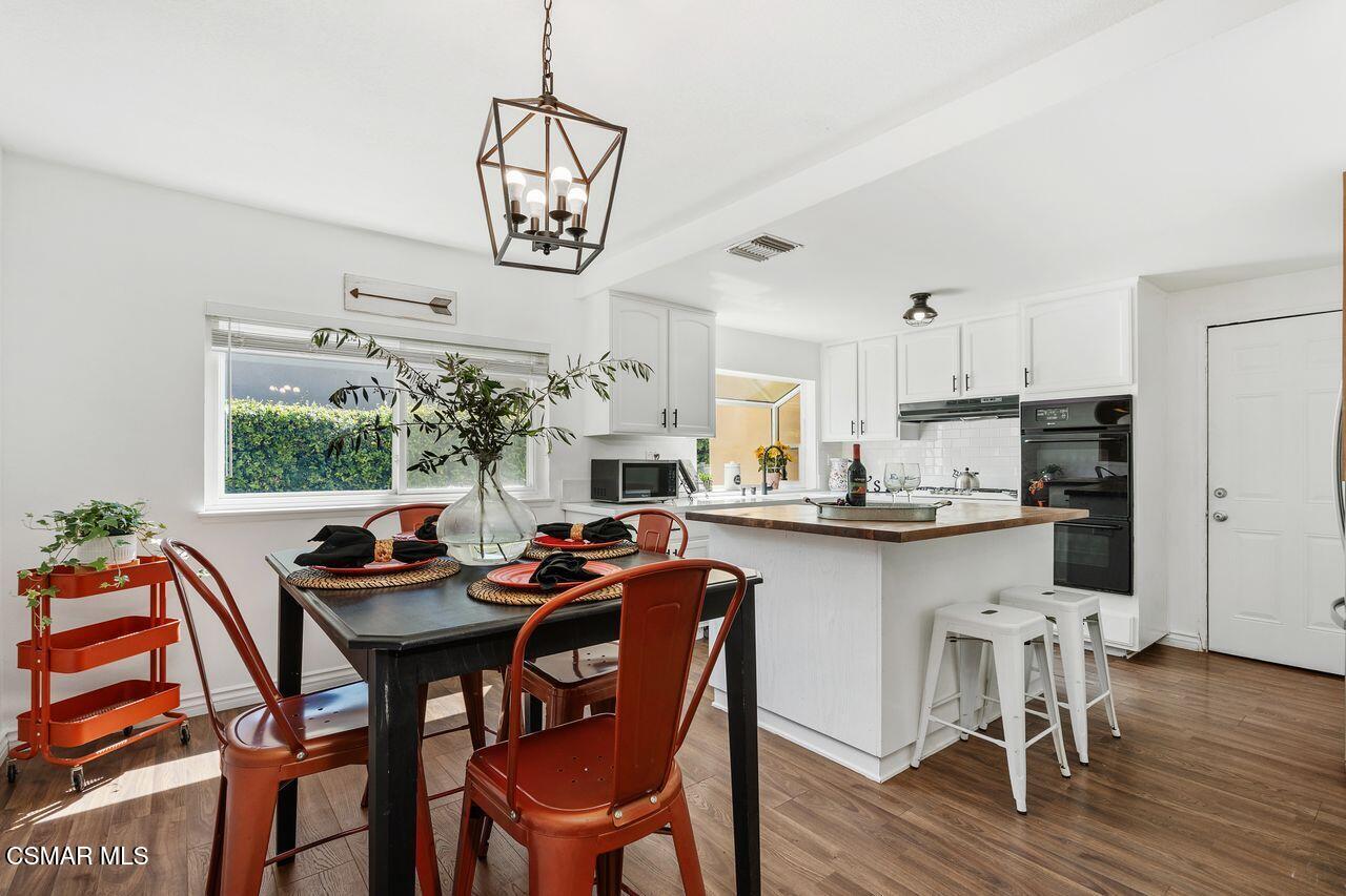 2142 Atwater Avenue Simi Valley, CA 93063 - Photo 12 of 36 a dining room filled chandelier and wooden floor