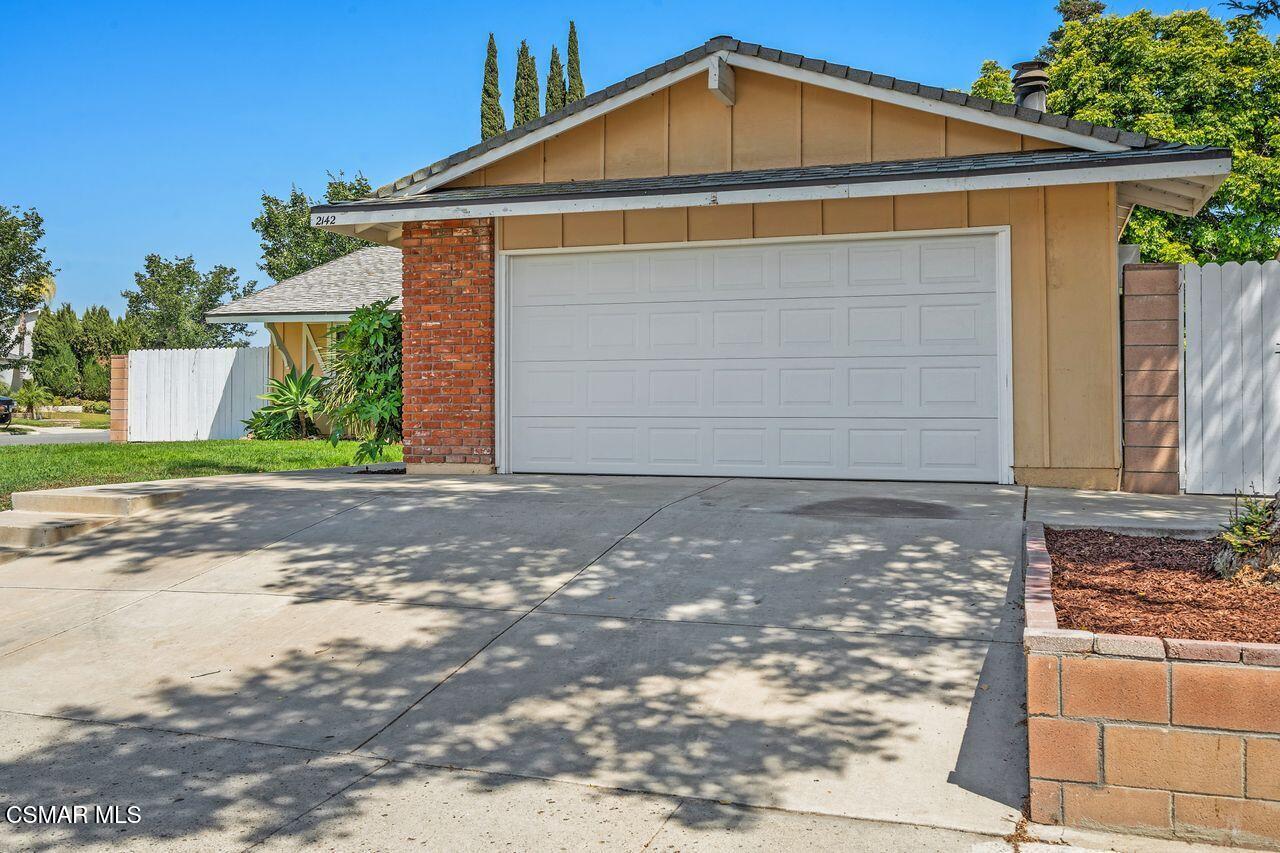 2142 Atwater Avenue Simi Valley, CA 93063 - Photo 2 of 36 a front view of a house with a yard and garage