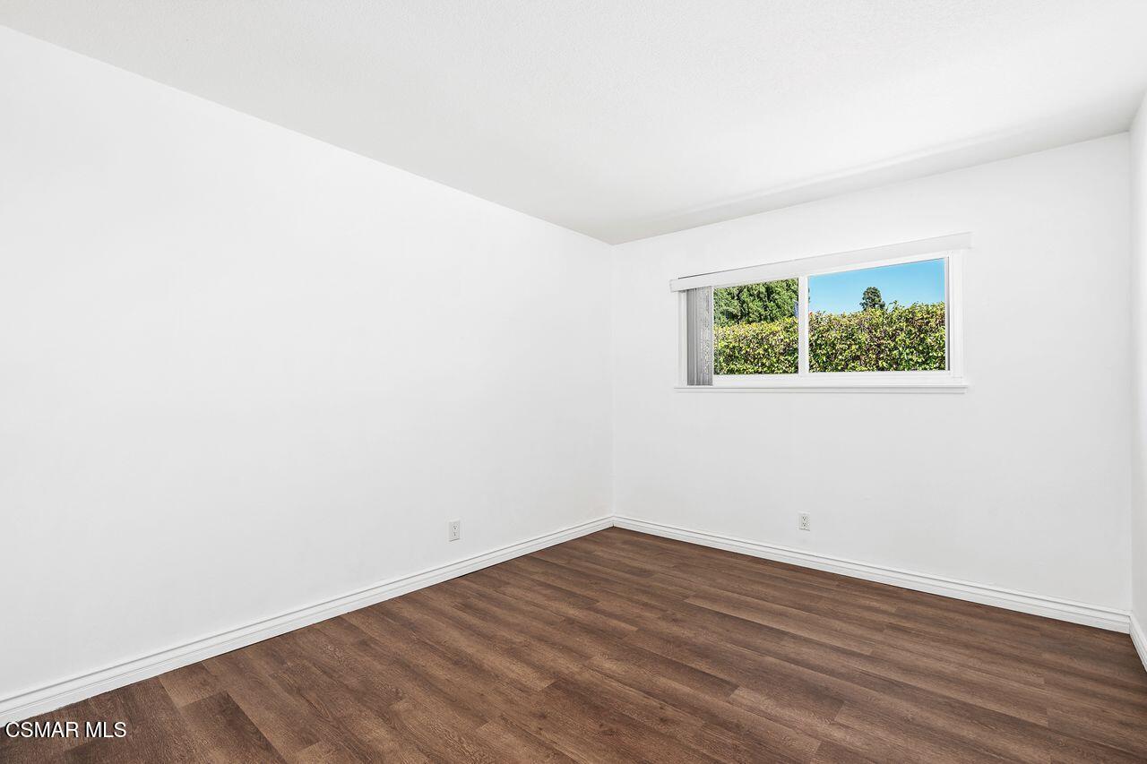 2142 Atwater Avenue Simi Valley, CA 93063 - Photo 24 of 36 an empty room with wooden floor and window