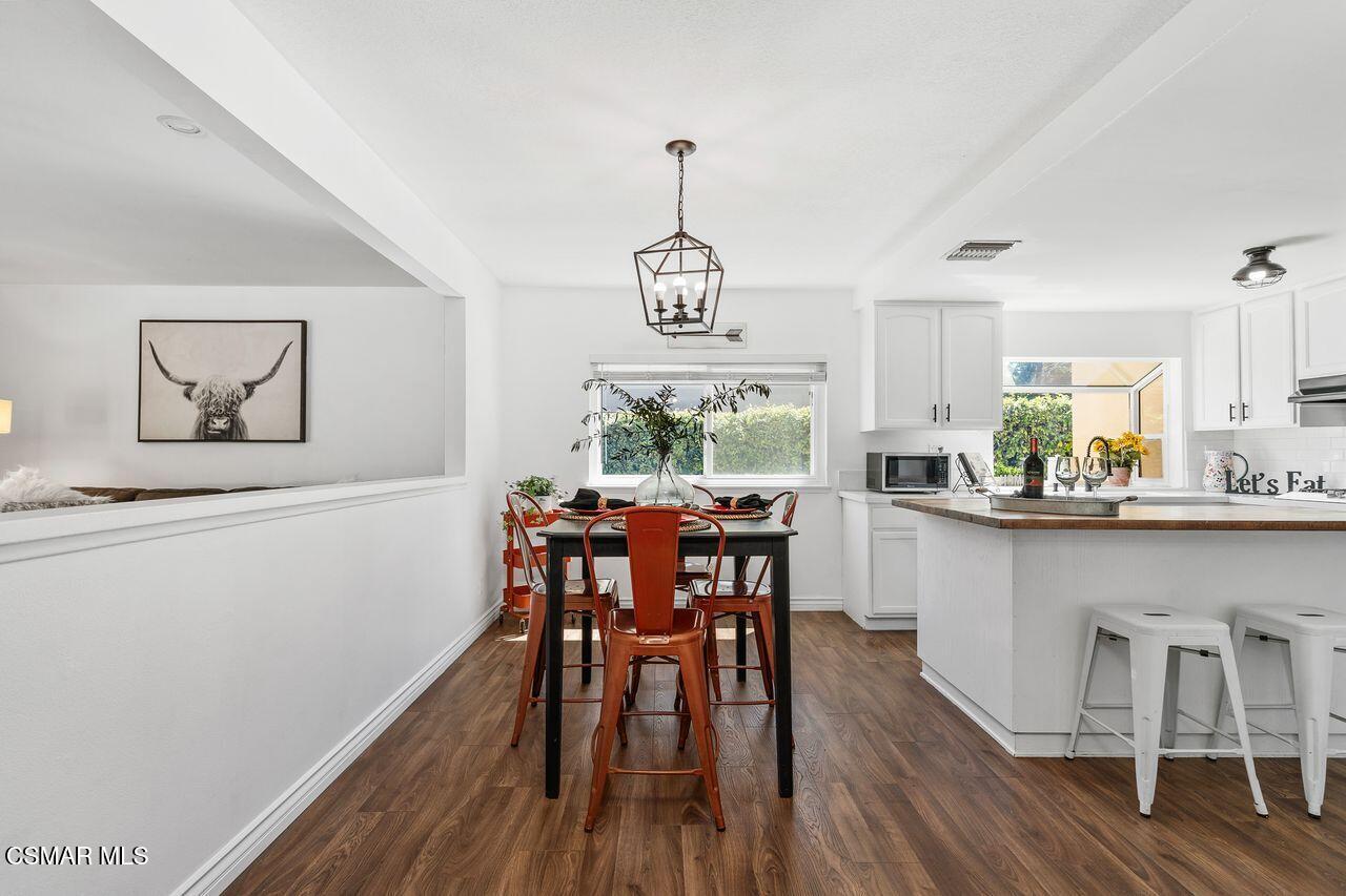 2142 Atwater Avenue Simi Valley, CA 93063 - Photo 10 of 36 a view of a dining room with furniture window and wooden floor