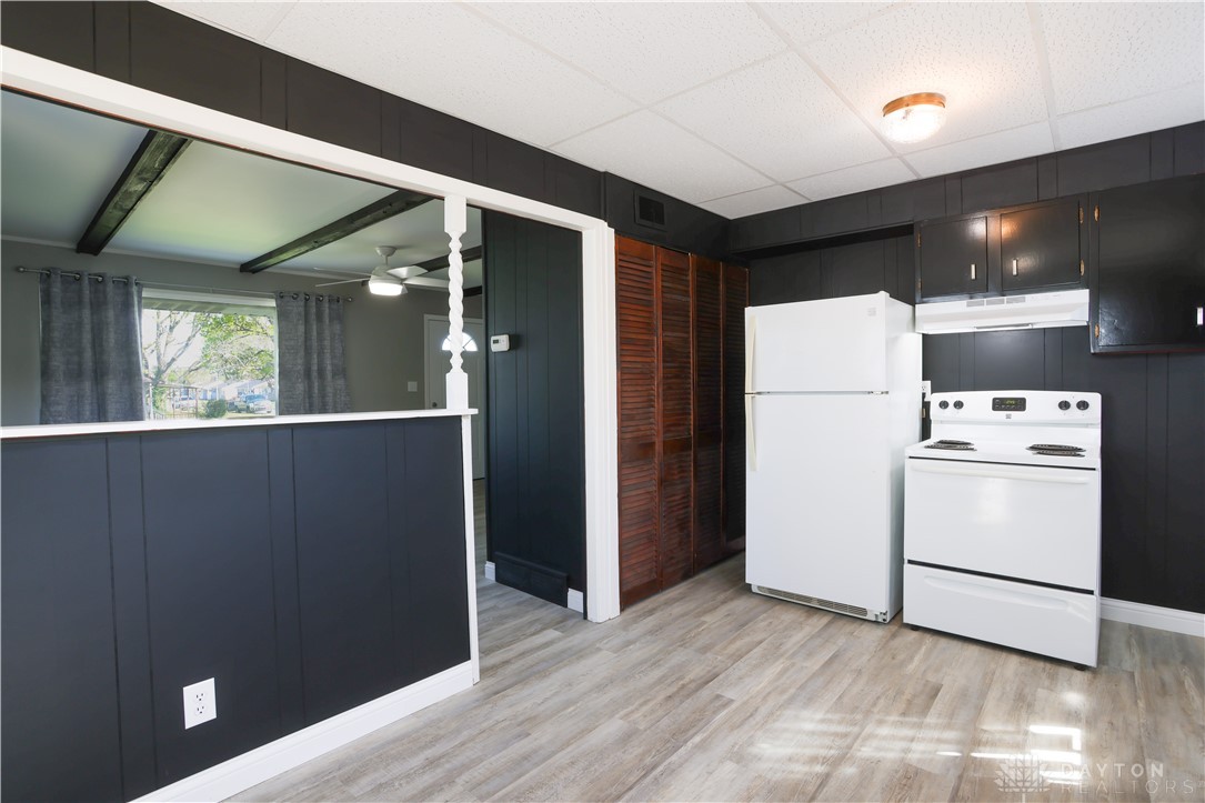 1627 Joselin Road Dayton, OH 45432 - Photo 12 of 28 This spacious kitchen offers essential appliances and ample room for culinary creativity.
