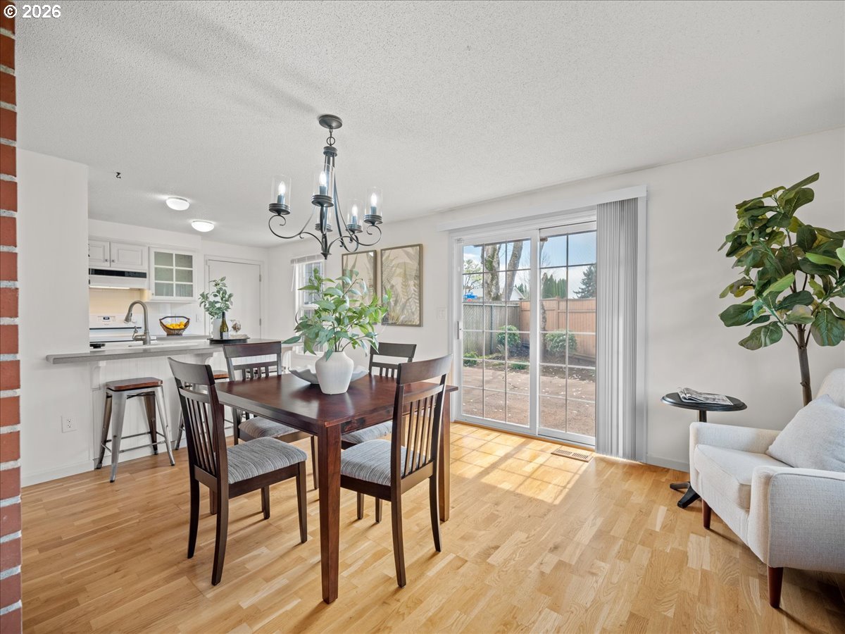 3775 3rd Avenue North Keizer, OR 97303 - Photo 12 of 32 a view of a dining room with furniture window and wooden floor