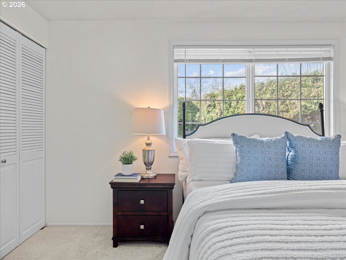 3775 3rd Avenue North Keizer, OR 97303 - Photo 21 of 32 a bed sitting in a bedroom next to a window
