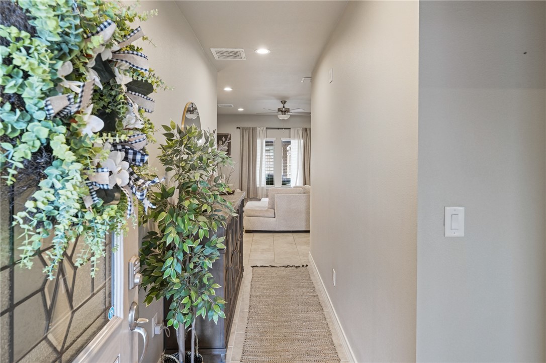 103 Donegal Street Sinton, TX 78387 - Photo 4 of 29 a view of a hallway with flower plants